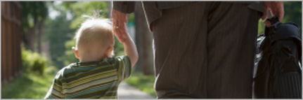 child holding hand of parent who is leaving